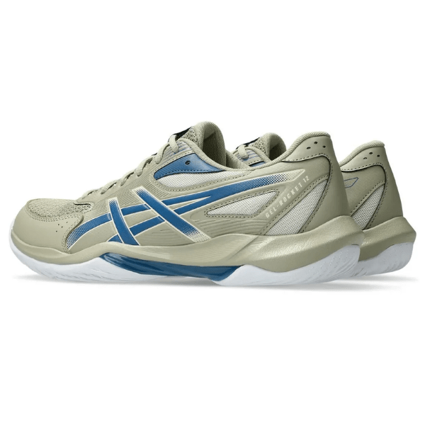 Beige and blue athletic shoe on a white background
