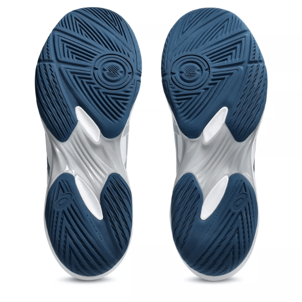Close-up of blue and white athletic shoes with tread pattern on a white background