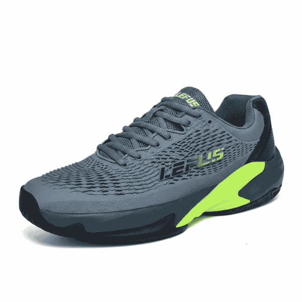 Gray athletic shoe with green accents on a white background