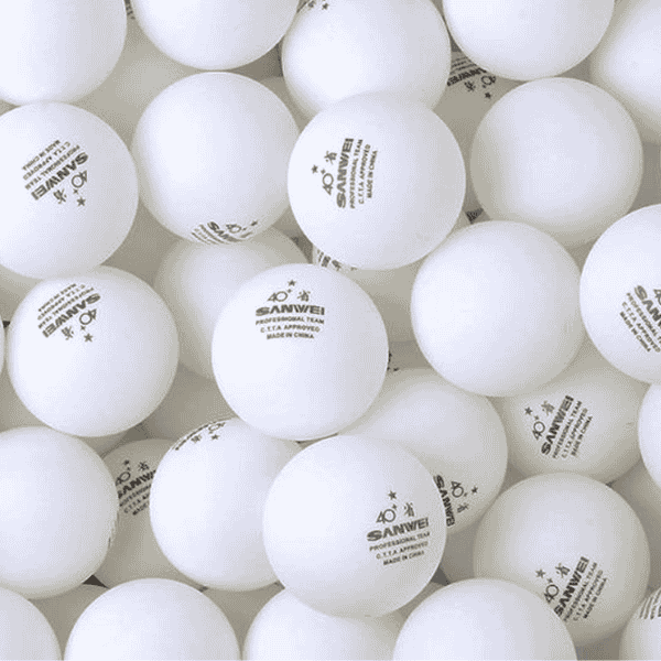 Close-up of multiple white ping pong balls with 'Sanwei' branding.