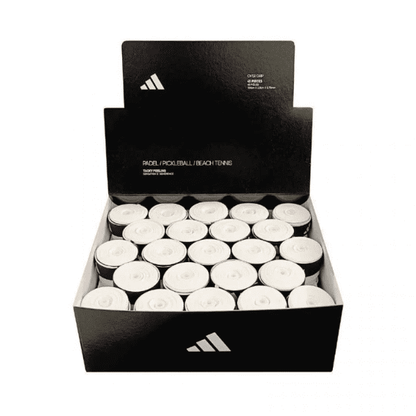 White Adidas overgrip rolls for padel, pickleball, and beach tennis, displayed in a product box.