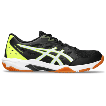 Black and yellow athletic shoe with orange sole on a white background