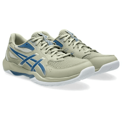 Pair of beige and blue running shoes on a white background