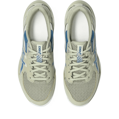 Pair of beige and blue Asics sneakers on a white background
