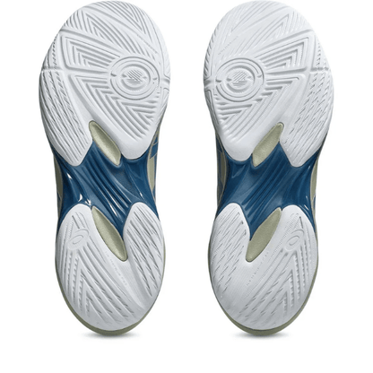 Close-up of blue and white athletic shoes with tread pattern on a white background