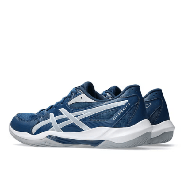 Pair of blue and white athletic shoes on a white background