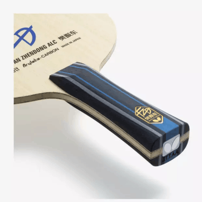 Close-up of a table tennis paddle with brand name and model details on a white background