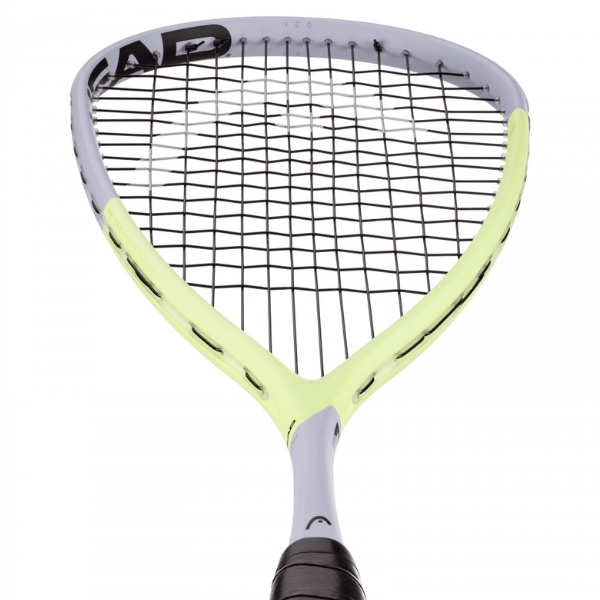 Racquet with yellow strings and black frame on a white background
