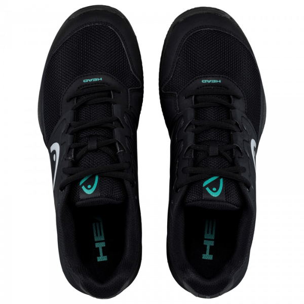 Black running shoes with teal accents on a white background