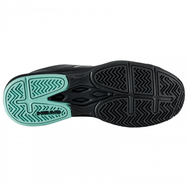 Black and green sole of a shoe on a white background