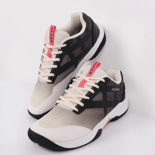 Pair of black, white, and pink sneakers on a white background