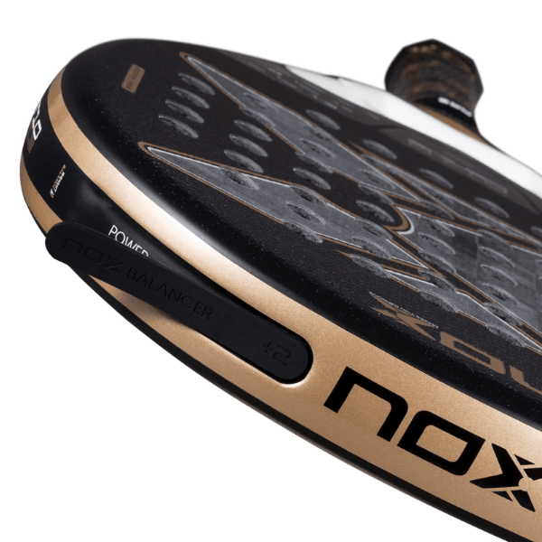 Close-up of a golf club head with 'NOX' branding on a white background
