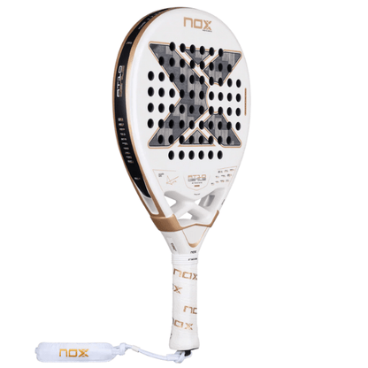 White and gold NOX paddle racket on a white background