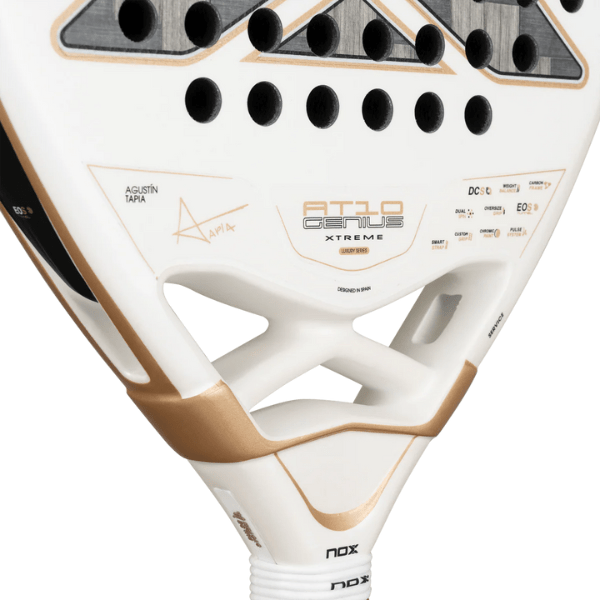 Close-up of a white and gold sports equipment with branding on a white background
