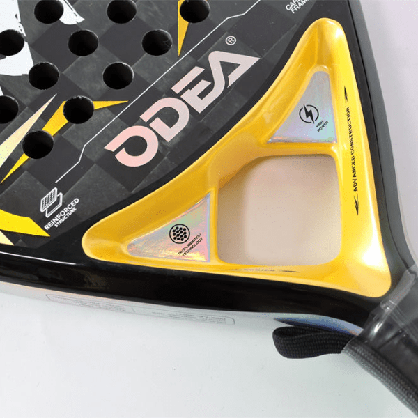 Close-up of a black and yellow sports equipment with 'ODEA' branding on a white background