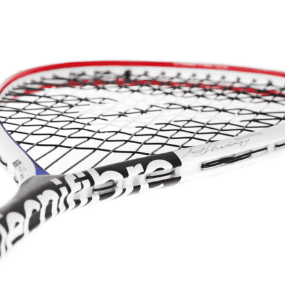 Close-up of a tennis racket with a white handle and red rim on a white background
