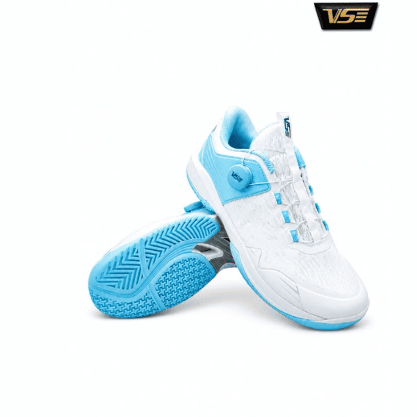 VS white and aqua court shoes with cushioned sole and textured grip outsole on a white background.
