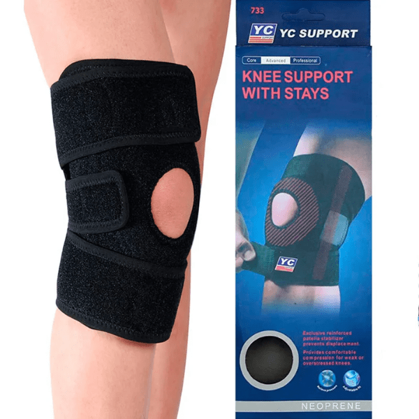 Black knee support brace on a person's knee with YC Support packaging to the right.